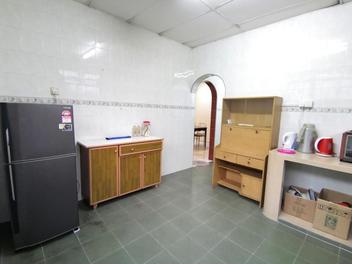 Cosy Homestay อูลูติรัม ภายนอก รูปภาพ