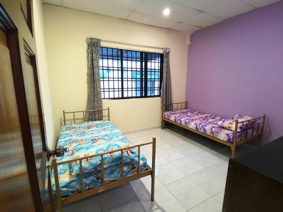 Cosy Homestay อูลูติรัม ภายนอก รูปภาพ